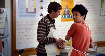 Movie still from “Superbad” (2007), directed by Greg Mottola – Two young men standing next to each other in a classroom; Medium shot, Over the shoulder angle