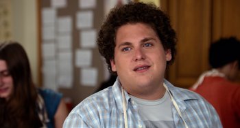 Movie still from “Superbad” (2007), directed by Greg Mottola – A person wearing a plaid shirt; Close Up shot, Over the shoulder angle