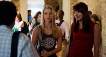 Movie still from “Superbad” (2007), directed by Greg Mottola – Two young women standing next to each other in a room; Medium shot, Over the shoulder angle