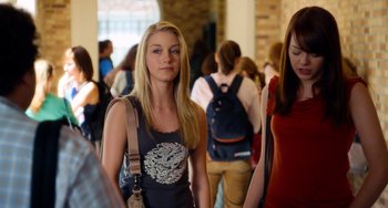 Movie still from “Superbad” (2007), directed by Greg Mottola – A woman with long blonde hair is walking in a crowd of people; Medium shot, Over the shoulder angle