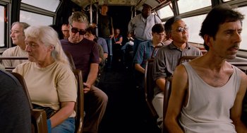 Movie still from “Superbad” (2007), directed by Greg Mottola – A group of people sitting on a bus; Medium shot, High angle