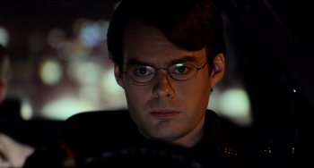 Movie still from “Superbad” (2007), directed by Greg Mottola – A person wearing glasses; Close Up shot, Over the shoulder angle