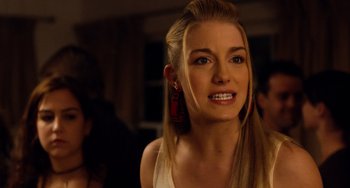 Movie still from “Superbad” (2007), directed by Greg Mottola – A beautiful young lady with long blonde hair and blue eyes; Close Up shot, Over the shoulder angle
