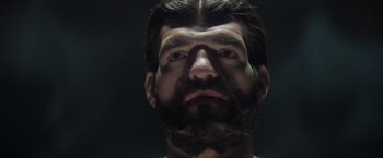 Movie still from “Superman” (1978), directed by Richard Donner – A man's face with a beard; Extreme Close Up shot, Low angle