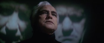 Movie still from “Superman” (1978), directed by Richard Donner – An older man with white hair looking up at the sky; Close Up shot, Low angle