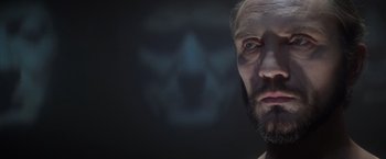 Movie still from “Superman” (1978), directed by Richard Donner – A man with a beard is looking at the camera; Close Up shot, Low angle