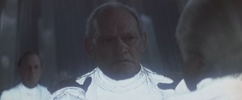 Movie still from “Superman” (1978), directed by Richard Donner – An old man with white hair and a white shirt; Close Up shot, Low angle