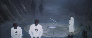 Movie still from “Superman” (1978), directed by Richard Donner – A man standing in front of an empty room; Wide shot, High angle