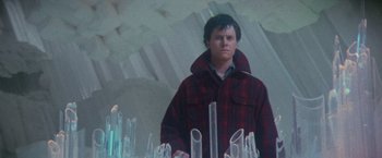 Movie still from “Superman” (1978), directed by Richard Donner – A man standing in front of a bunch of glass pipes; Medium shot, Low angle