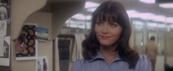 Movie still from “Superman” (1978), directed by Richard Donner – A person wearing a blue shirt; Close Up shot, Over the shoulder angle