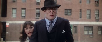 Movie still from “Superman” (1978), directed by Richard Donner – A man in a suit and a hat and glasses; Close Up shot, Low angle