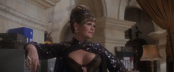 Movie still from “Superman” (1978), directed by Richard Donner – A person wearing a black dress; Medium shot, Low angle