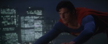 Movie still from “Superman” (1978), directed by Richard Donner – A person wearing a superman costume; Medium shot, Low angle