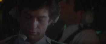 Movie still from “Superman” (1978), directed by Richard Donner – A person wearing a headset; Close Up shot, Over the shoulder angle