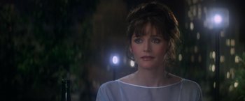 Movie still from “Superman” (1978), directed by Richard Donner – A person wearing a white shirt; Close Up shot, Over the shoulder angle