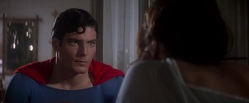 Movie still from “Superman” (1978), directed by Richard Donner – A man in a superman costume looking into a mirror; Close Up shot, Over the shoulder angle