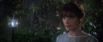 Movie still from “Superman” (1978), directed by Richard Donner – A person wearing a white shirt; Close Up shot, Over the shoulder angle