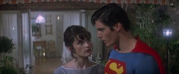 Movie still from “Superman” (1978), directed by Richard Donner – A man and a woman standing next to each other; Close Up shot, Over the shoulder angle