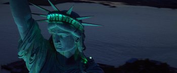 Movie still from “Superman” (1978), directed by Richard Donner – The statue of liberty is lit up with green light; Extreme Wide shot, Low angle