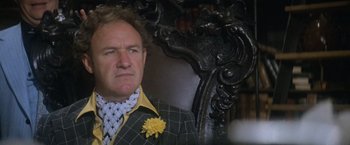 Movie still from “Superman” (1978), directed by Richard Donner – A person wearing a suit and tie; Close Up shot, Low angle