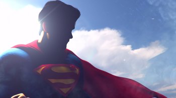 Movie still from “Superman: Man of Tomorrow” (2020), directed by Chris Palmer – A man in a superman costume with a sky background; Medium shot, Low angle