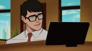 Movie still from “Superman: Man of Tomorrow” (2020), directed by Chris Palmer – A man with glasses is looking at a computer screen; Close Up shot, Over the shoulder angle