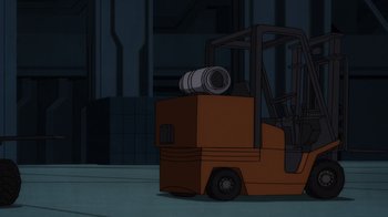 Movie still from “Superman: Man of Tomorrow” (2020), directed by Chris Palmer – An orange forklift is parked in a warehouse; Extreme Wide shot, Low angle