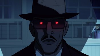 Movie still from “Superman: Man of Tomorrow” (2020), directed by Chris Palmer – A man wearing a hat and glasses and a suit; Close Up shot, Low angle