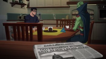 Movie still from “Superman: Man of Tomorrow” (2020), directed by Chris Palmer – A man sitting at a dinner table with a newspaper; Wide shot, Over the shoulder angle