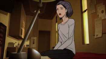 Movie still from “Superman: Man of Tomorrow” (2020), directed by Chris Palmer – A woman sitting on the ground in a room; Medium shot, High angle