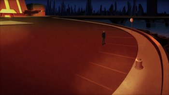 Movie still from “Superman: Man of Tomorrow” (2020), directed by Chris Palmer – A man standing in a parking lot at night; Extreme Wide shot, High angle