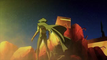 Movie still from “Superman: Man of Tomorrow” (2020), directed by Chris Palmer – A man standing on a hill with a cape on; Extreme Wide shot, Low angle