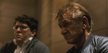 Movie still from “Superpower” (2023), directed by Aaron Kaufman – A man with long blonde hair is looking into the distance; Close Up shot, Low angle