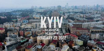 Movie still from “Superpower” (2023), directed by Aaron Kaufman – An aerial view of a large city with buildings; Extreme Wide shot, High angle