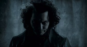 Movie still from “Sweeney Todd: The Demon Barber of Fleet Street” (2007), directed by Tim Burton – A person with long hair; Close Up shot, Low angle