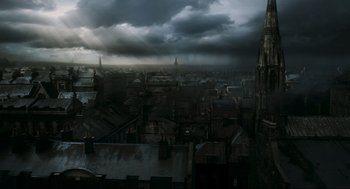 Movie still from “Sweeney Todd: The Demon Barber of Fleet Street” (2007), directed by Tim Burton – A view of a city from a distance with dark clouds; Extreme Wide shot, High angle