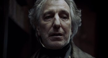 Movie still from “Sweeney Todd: The Demon Barber of Fleet Street” (2007), directed by Tim Burton – An older man with a beard and a mustache; Close Up shot, Low angle