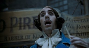 Movie still from “Sweeney Todd: The Demon Barber of Fleet Street” (2007), directed by Tim Burton – A man with a surprised look on his face; Close Up shot, Low angle