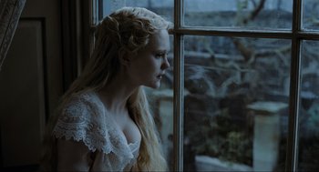 Movie still from “Sweeney Todd: The Demon Barber of Fleet Street” (2007), directed by Tim Burton – A woman with long blonde hair looking out of a window; Close Up shot, Over the shoulder angle