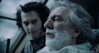 Movie still from “Sweeney Todd: The Demon Barber of Fleet Street” (2007), directed by Tim Burton – A man with a beard and a man with a mustache; Close Up shot, Over the shoulder angle