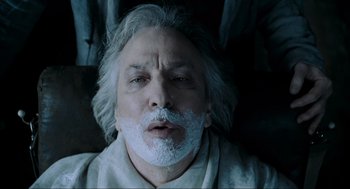 Movie still from “Sweeney Todd: The Demon Barber of Fleet Street” (2007), directed by Tim Burton – An old man with a white beard and mustache; Close Up shot, Low angle