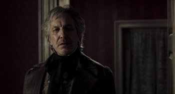 Movie still from “Sweeney Todd: The Demon Barber of Fleet Street” (2007), directed by Tim Burton – An old man with long white hair wearing a suit; Close Up shot, Low angle