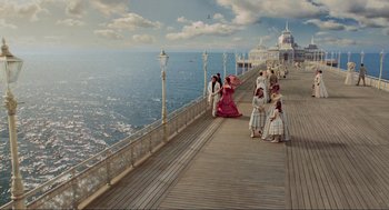 Movie still from “Sweeney Todd: The Demon Barber of Fleet Street” (2007), directed by Tim Burton – A group of people standing on top of a wooden pier; Extreme Wide shot, High angle