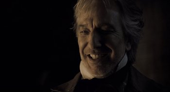 Movie still from “Sweeney Todd: The Demon Barber of Fleet Street” (2007), directed by Tim Burton – A person wearing a suit and tie; Close Up shot, Low angle