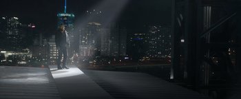 Movie still from “Sweet Girl” (2021), directed by Brian Andrew Mendoza – A view of a city at night from a pier; Extreme Wide shot, Low angle