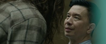 Movie still from “Sweet Girl” (2021), directed by Brian Andrew Mendoza – A person with long black hair; Close Up shot, Over the shoulder angle