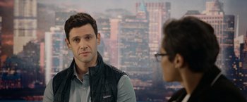 Movie still from “Sweet Girl” (2021), directed by Brian Andrew Mendoza – A man and a woman are talking in front of a city skyline; Close Up shot, Over the shoulder angle