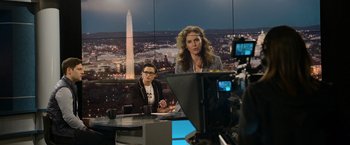 Movie still from “Sweet Girl” (2021), directed by Brian Andrew Mendoza – A woman is sitting in front of a camera; Medium shot, Over the shoulder angle