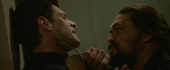 Movie still from “Sweet Girl” (2021), directed by Brian Andrew Mendoza – Two men are shaving each other's beard; Close Up shot, Over the shoulder angle