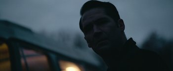 Movie still from “Sweet Girl” (2021), directed by Brian Andrew Mendoza – A person looking at the camera; Close Up shot, Over the shoulder angle